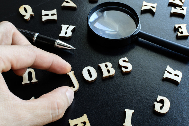 Finger pick a wood letters of jobs search - Photo, Image