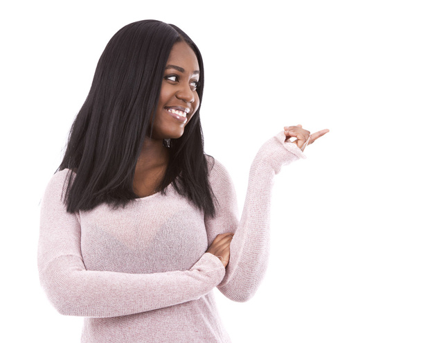 casual black woman pointing - 写真・画像