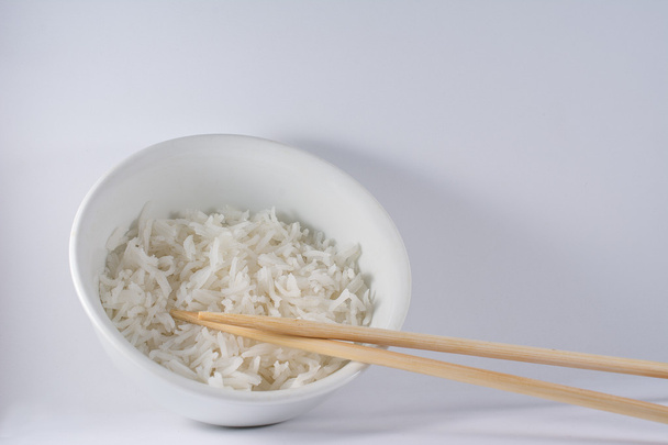 Bowl of White Rice with Wooden Chopsticks - Фото, изображение