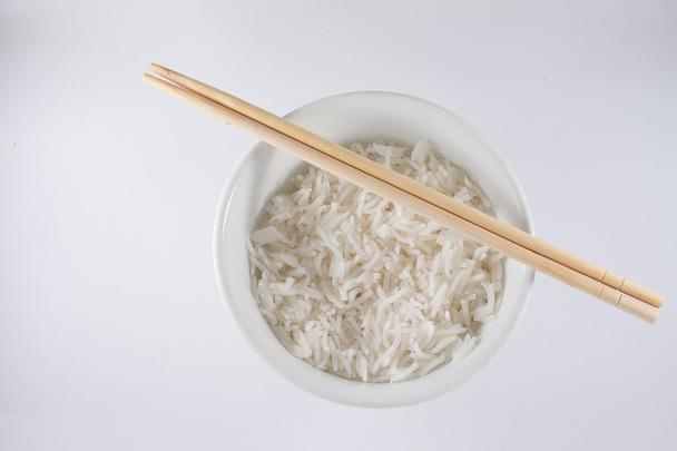 Bowl of White Rice with Wooden Chopsticks - Photo, Image