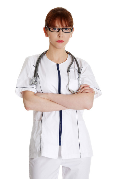 Serious nurse or young female medical doctor - Foto, imagen