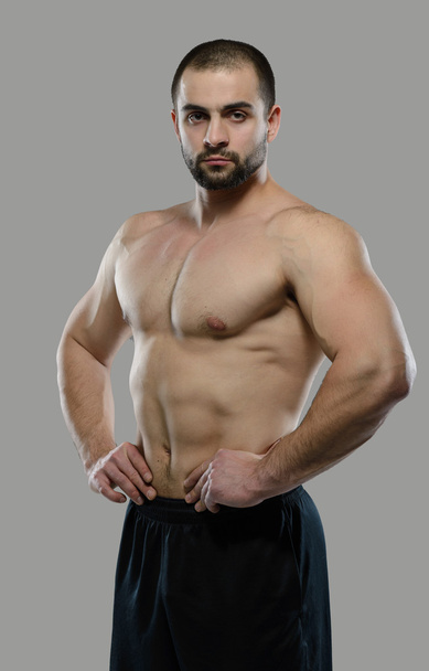 Great workout. Portrait of muscular professional bodybuilder - Fotografie, Obrázek