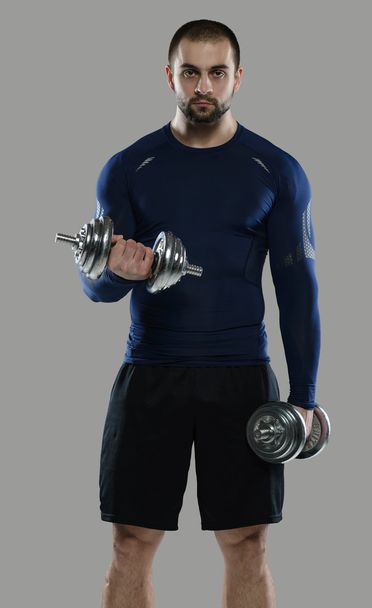 Great workout. Portrait of muscular professional bodybuilder - Zdjęcie, obraz