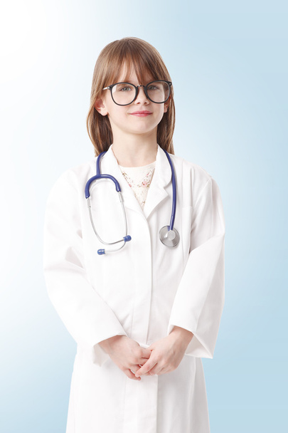 girl dressed up in doctor attire - Foto, imagen