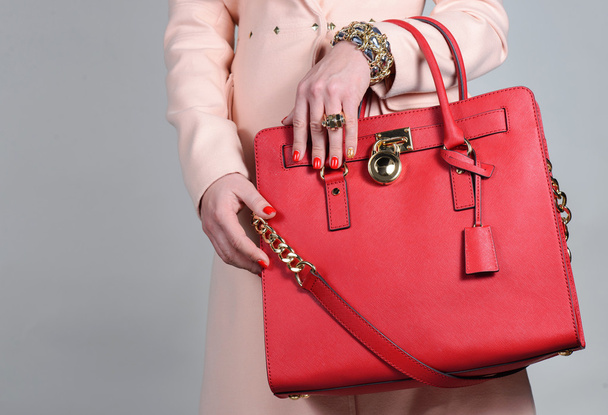 Red stylish glamorous female leather bag on pure background - Φωτογραφία, εικόνα