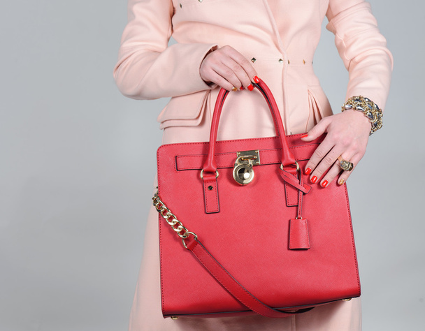Red stylish glamorous female leather bag on pure background - Photo, Image