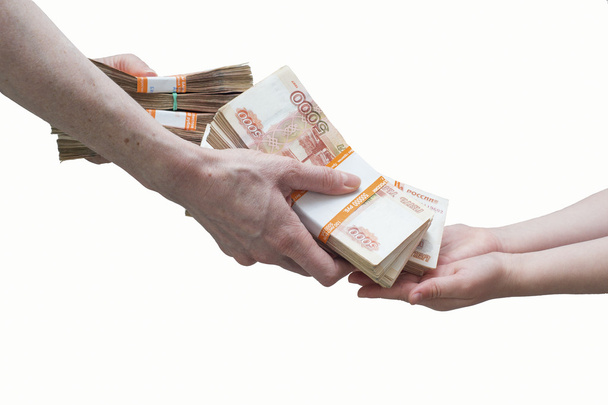 детская и женская рука со стопкой русских денег
 - Фото, изображение