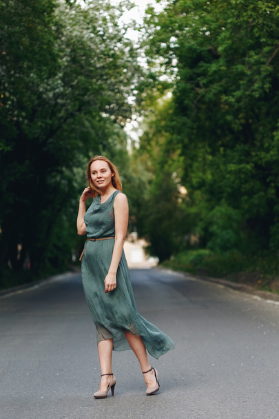 Young Woman Standing on the Road  - Fotografie, Obrázek