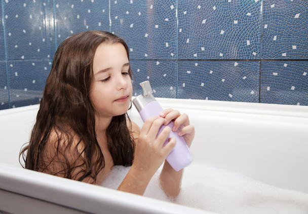 little girl taking a bath with shampoo - Photo, Image