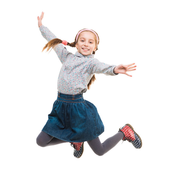 photo of joyful little girl jumping - Fotó, kép
