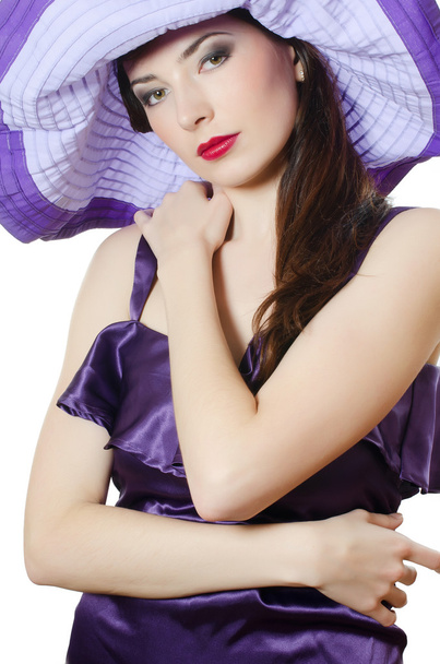 Portrait of the beautiful elegant woman in a lilac hat - Photo, Image