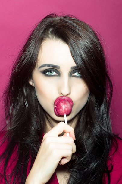 Girl licking lollipop - Φωτογραφία, εικόνα