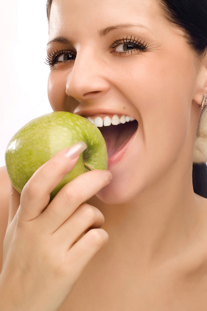Young woman eating apple - Foto, Bild