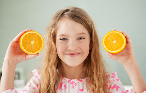 Cheerful girl with orange - Zdjęcie, obraz