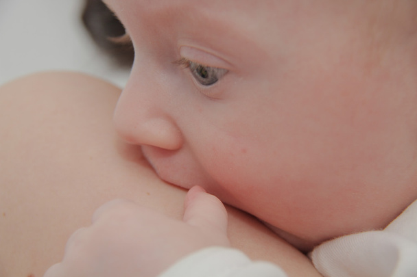 Mom breastfeeding baby boy with breast milk - Photo, Image