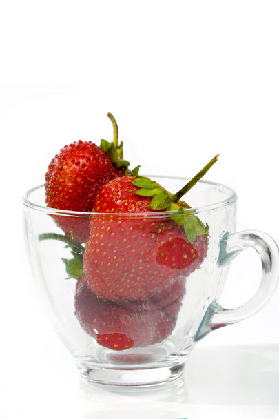 Strawberries in glass cup - Фото, зображення