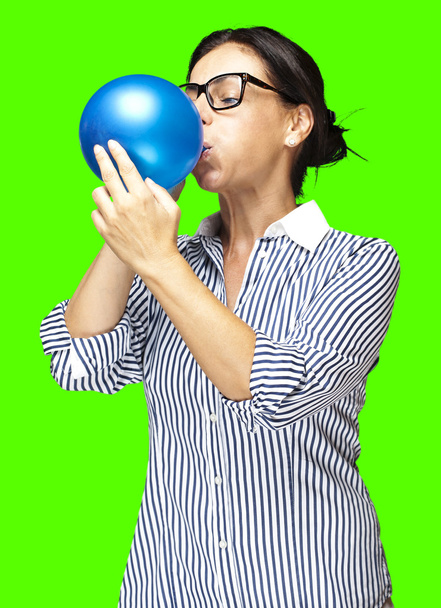Woman blowing a balloon - Photo, Image