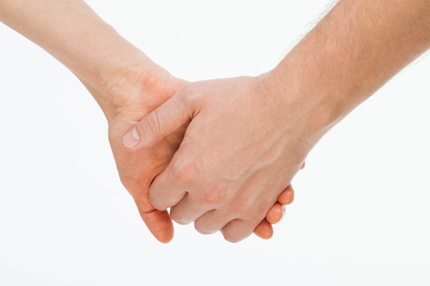 Man's hand gently holding woman's hand  - 写真・画像