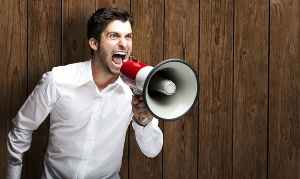 Man shouting with megaphone - Photo, image