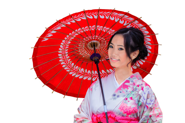 Genç Japon kadın kırmızı şemsiye ile izole - Fotoğraf, Görsel