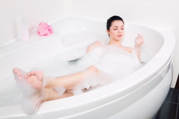 beautiful young woman takes bubble bath - Photo, Image