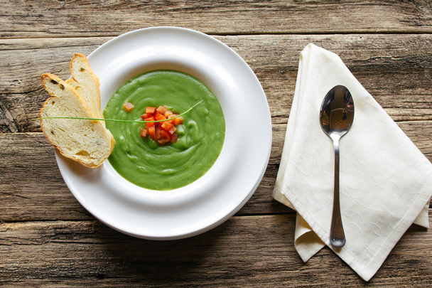 vegetarian food. Vegetable soup on wooden table - Фото, изображение