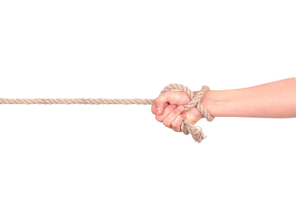 close up of hand pulling a rope on white background with clippin - Zdjęcie, obraz