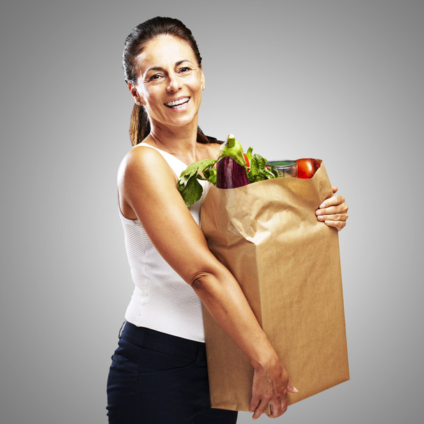 Woman with purchase - Фото, зображення