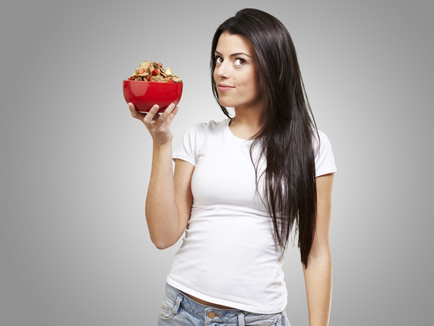 Woman holding a bowl with cereals - Photo, Image