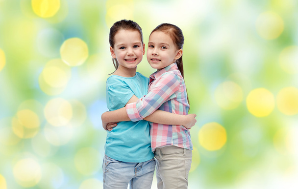 happy smiling little girls hugging - Фото, изображение