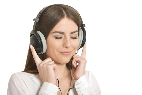 Girl listening  music in headphones. - Valokuva, kuva