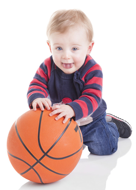 Casual baby playing with basketball ball - Фото, зображення