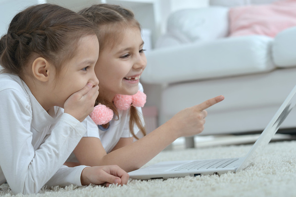 little girls looking at laptop - Fotó, kép