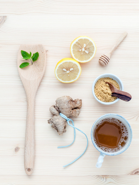 The cup of ginger tea with ginger roots , ginger powder ,lemon , - Photo, Image