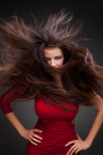 Young woman with hair flying - Фото, изображение