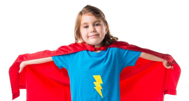 Girl dressed like superhero making fly gesture - Fotó, kép