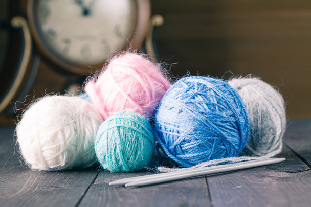 colorful yarn for knitting on a brown wooden table - Φωτογραφία, εικόνα