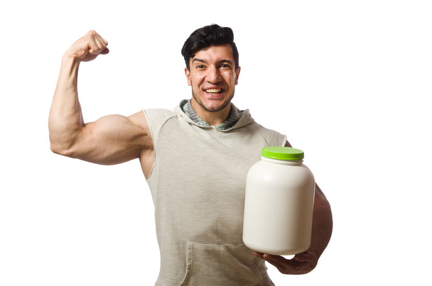 Muscular man with protein jars on white - Foto, Imagem