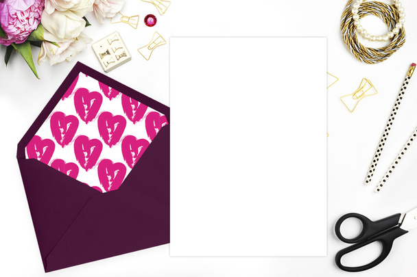 . Flat lay, wedding invitation blank. Woman modern scene, feminine background. Table view up.Glamour style.The workspace on the desk, envelope, scissors, Bracelet with flowers - Photo, Image