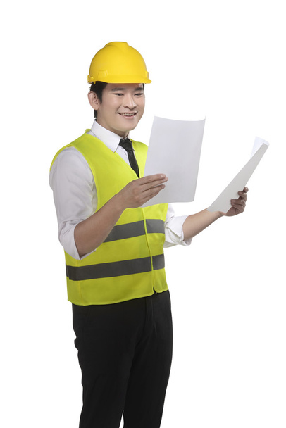 Asian worker holding blueprints - Foto, Imagen