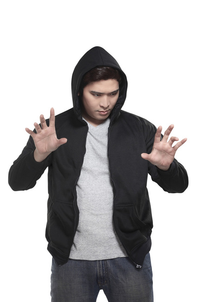 asian man in hoodie typing something - Фото, зображення