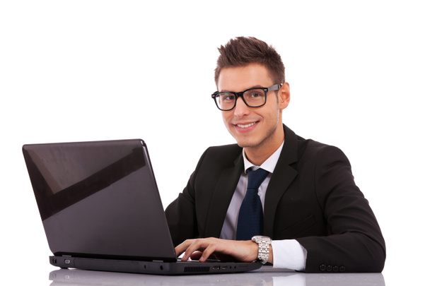 Business man wearing glasses using a laptop - Fotografie, Obrázek