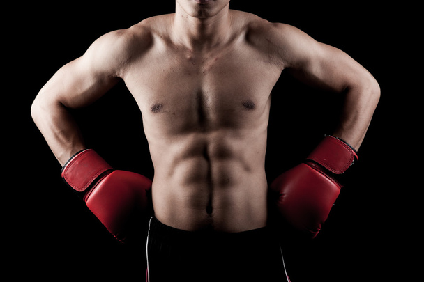 Muscular Asian man with red boxing glove - Φωτογραφία, εικόνα