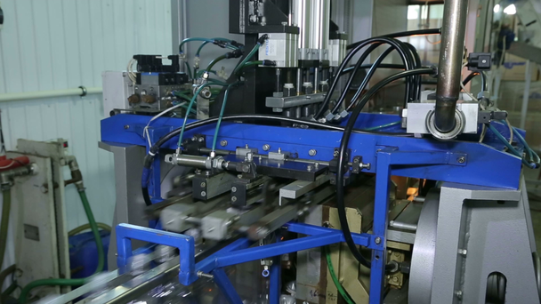 Production of plastic bottles.Automatic system. The production of plastic products. Conveyor. Machine to produce plastic bottles. Press.High production speed. The billet is heated then blown bottle. - Footage, Video