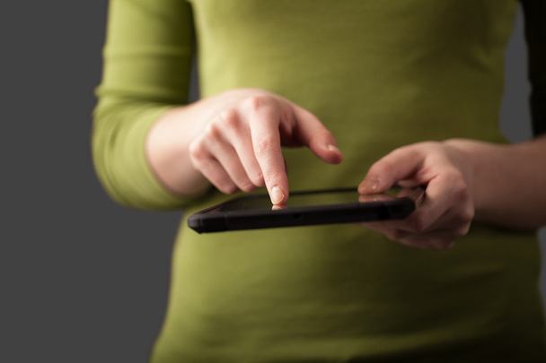 Close up of hand holding digital touchpad tablet device - Φωτογραφία, εικόνα