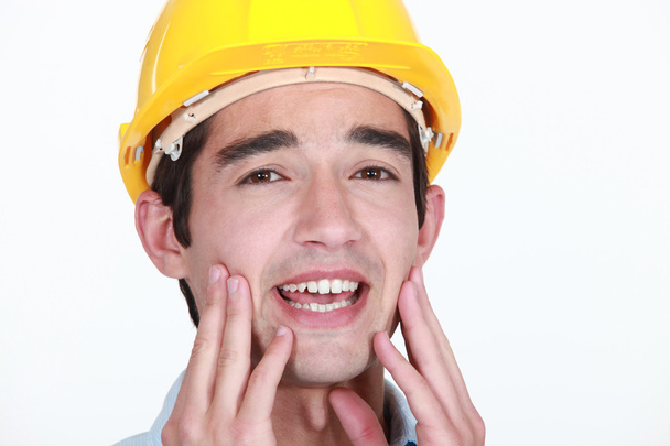 Construction worker with toothache - Foto, Bild