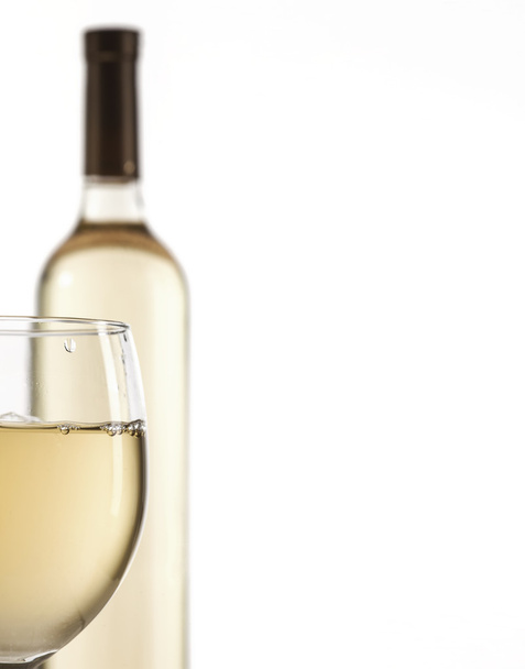 Wineglass and bottle with white wine - Photo, image