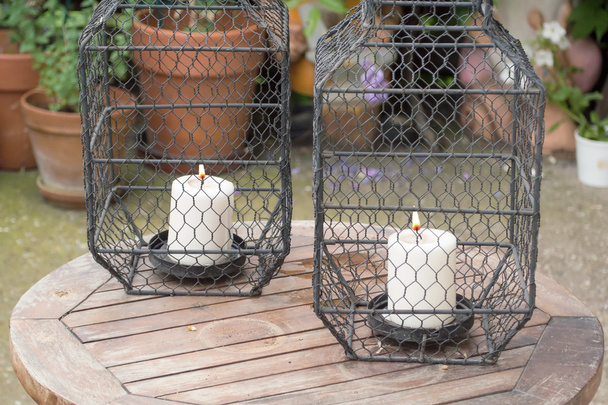 two candles in cages as decorative details - Photo, Image
