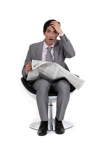 A businessman reading bad news. - Фото, зображення