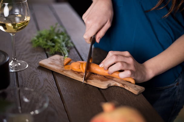 Woman cutting carrots - Fotó, kép